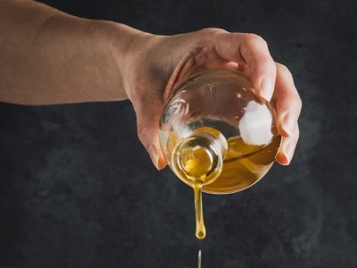Olive Oil Being Poured on Fresh Carrots